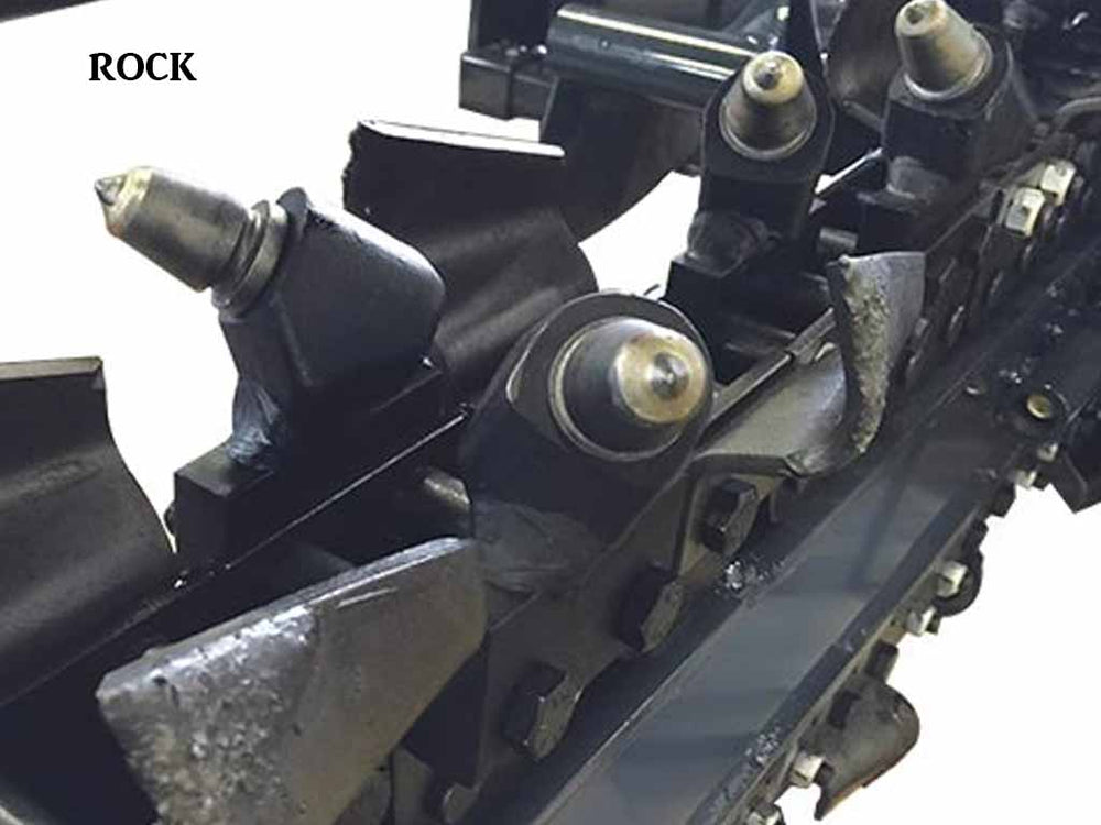 Virnig TRN v60 Trencher | Close-up of a mechanical component with 'ROCK' text on a white background